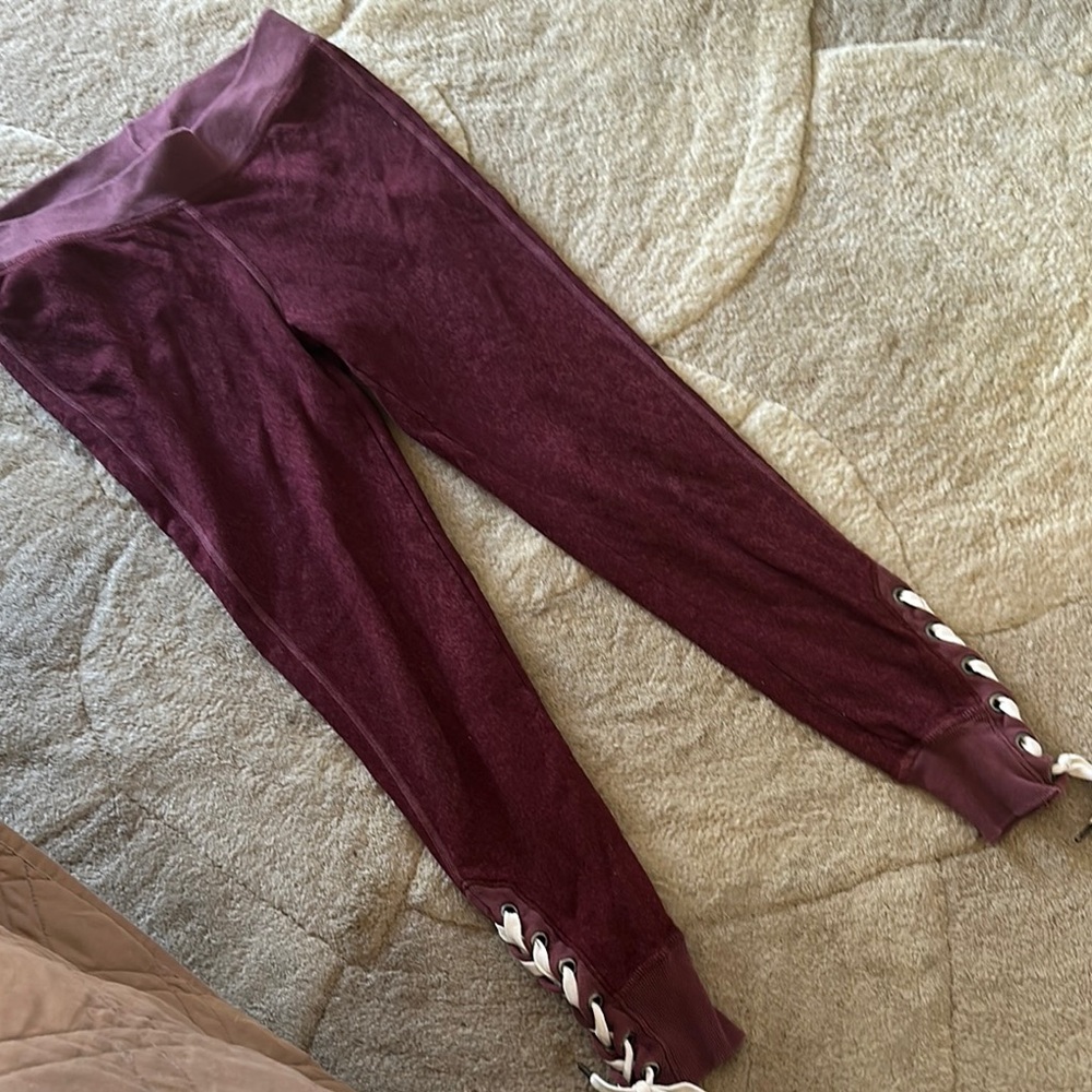 n:PHILANTHROPY Deep Red Leggings with Lace-Up Accent and back zipper pocket
